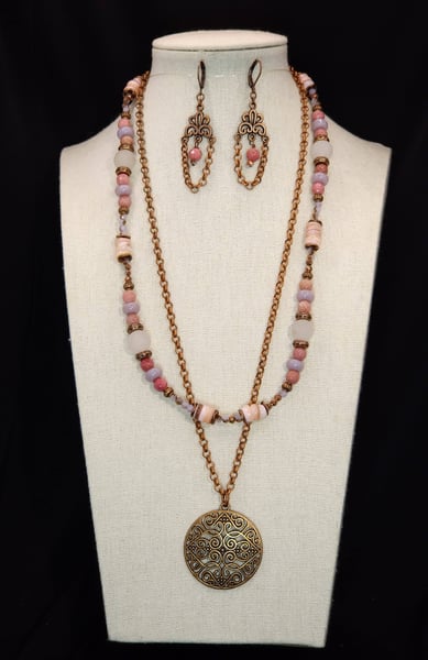 A Filigree Necklace design featuring a Filigree style focal with Freshwater shell, Matte Rose Quartz, and Pink  Rhodinite