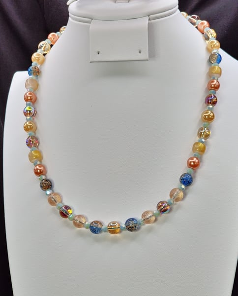 A variety of glass beads compose this single strand necklace.