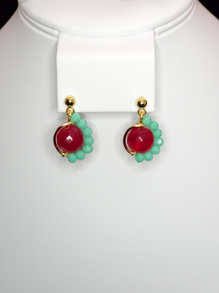 An asymmetrictal design featuring Red Dyed Quartz, Turquoise Glass and Stainless Steel Gold Earrings