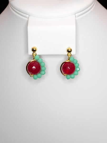 An asymmetrictal design featuring Red Dyed Quartz, Turquoise Glass and Stainless Steel Gold Earrings