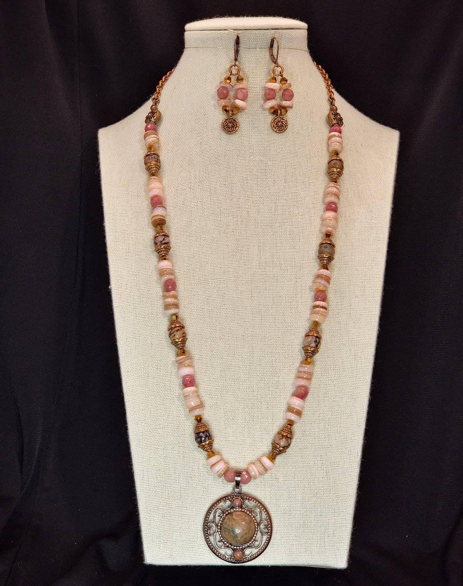 A Pink Rhodinite Focal with Rhodinite Accents and Pink Freshwater Shell beads