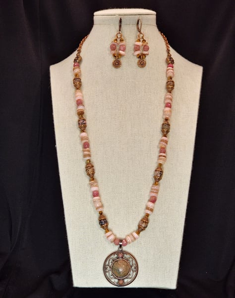 A Pink Rhodinite Focal with Rhodinite Accents and Pink Freshwater Shell beads