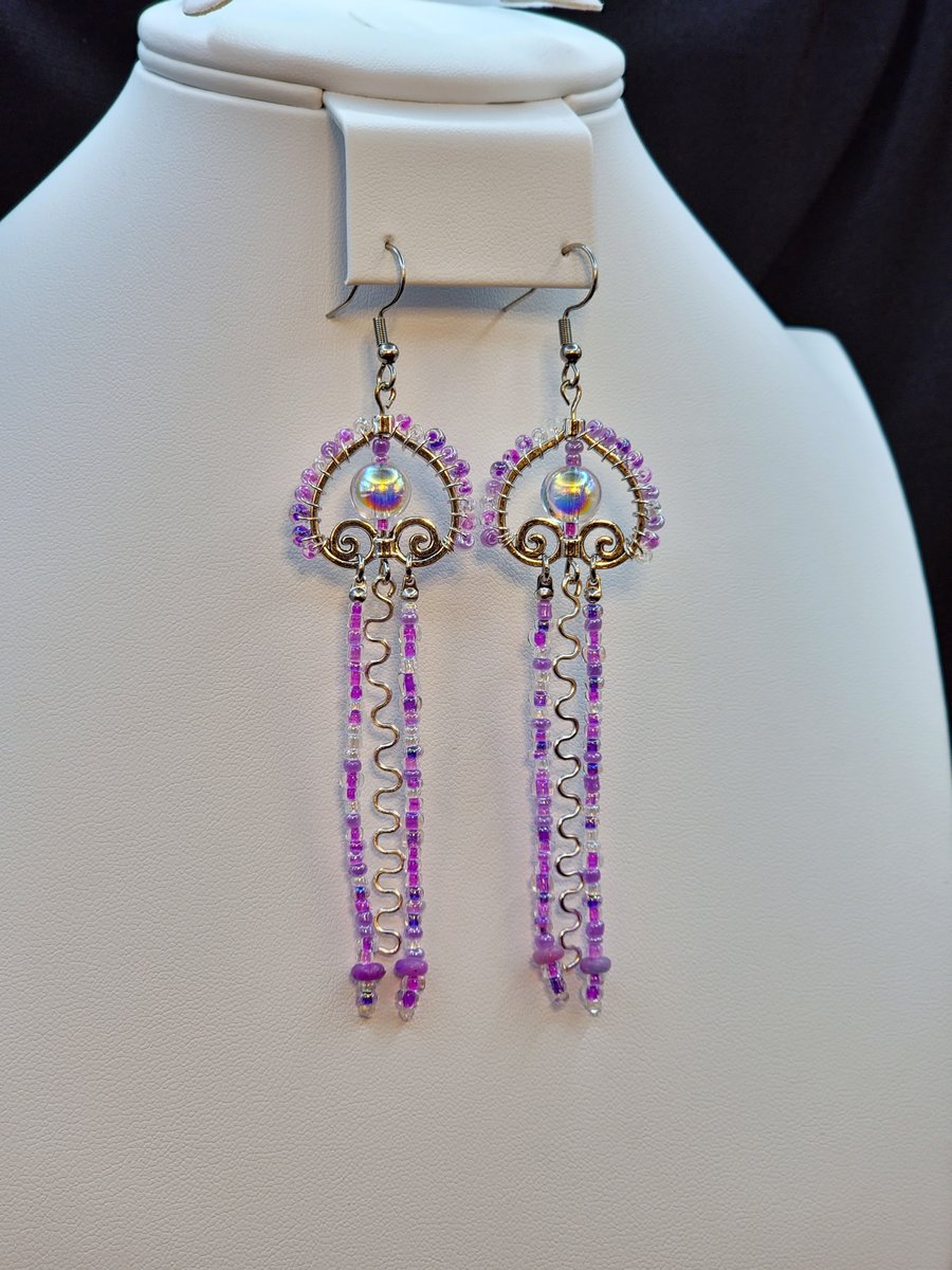 A fun artsy play on a Jellyfish design with purple glass beads