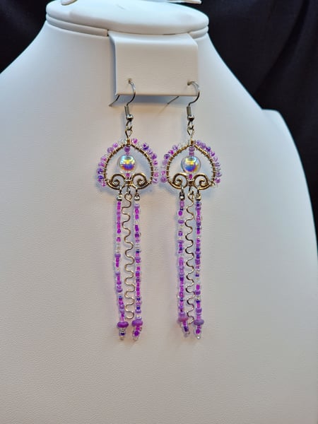 A fun artsy play on a Jellyfish design with purple glass beads